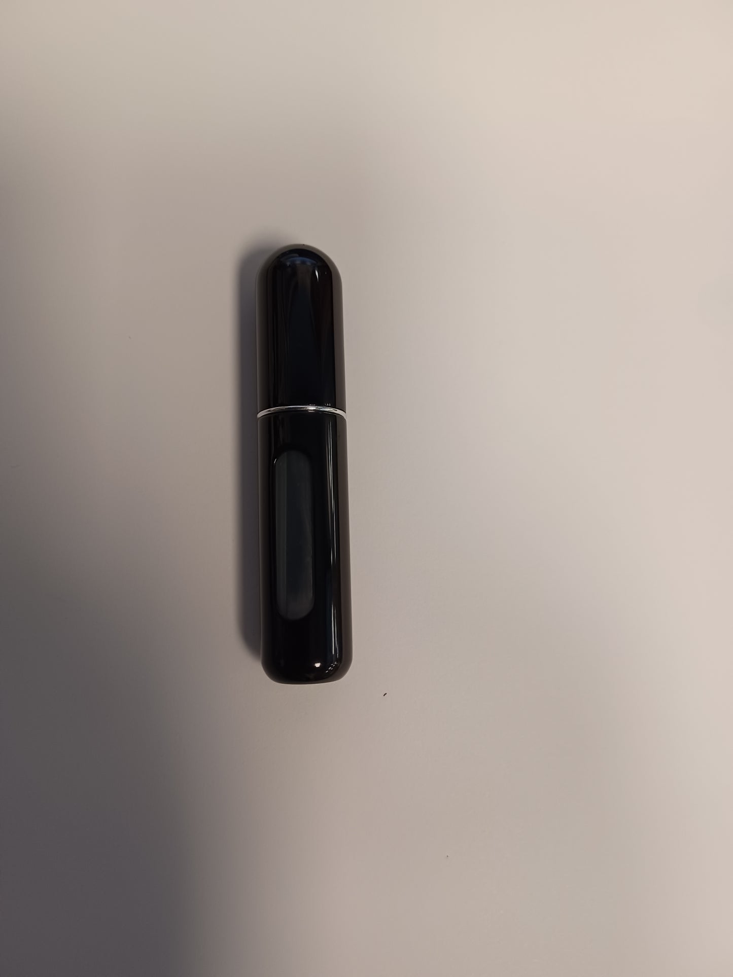 SHINY BLACK TRAVEL BOTTLE