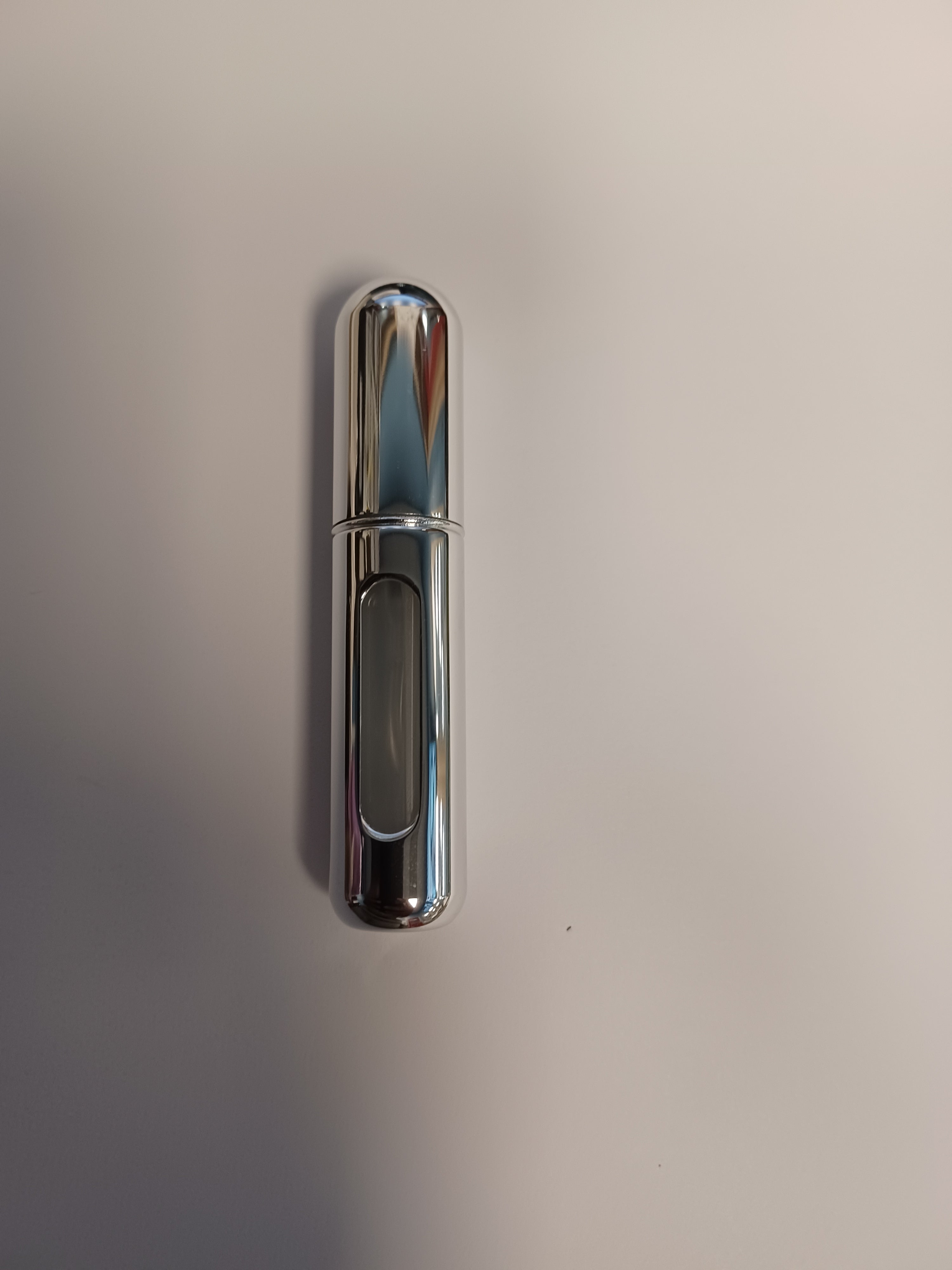 SHINY SILVER TRAVEL BOTTLE